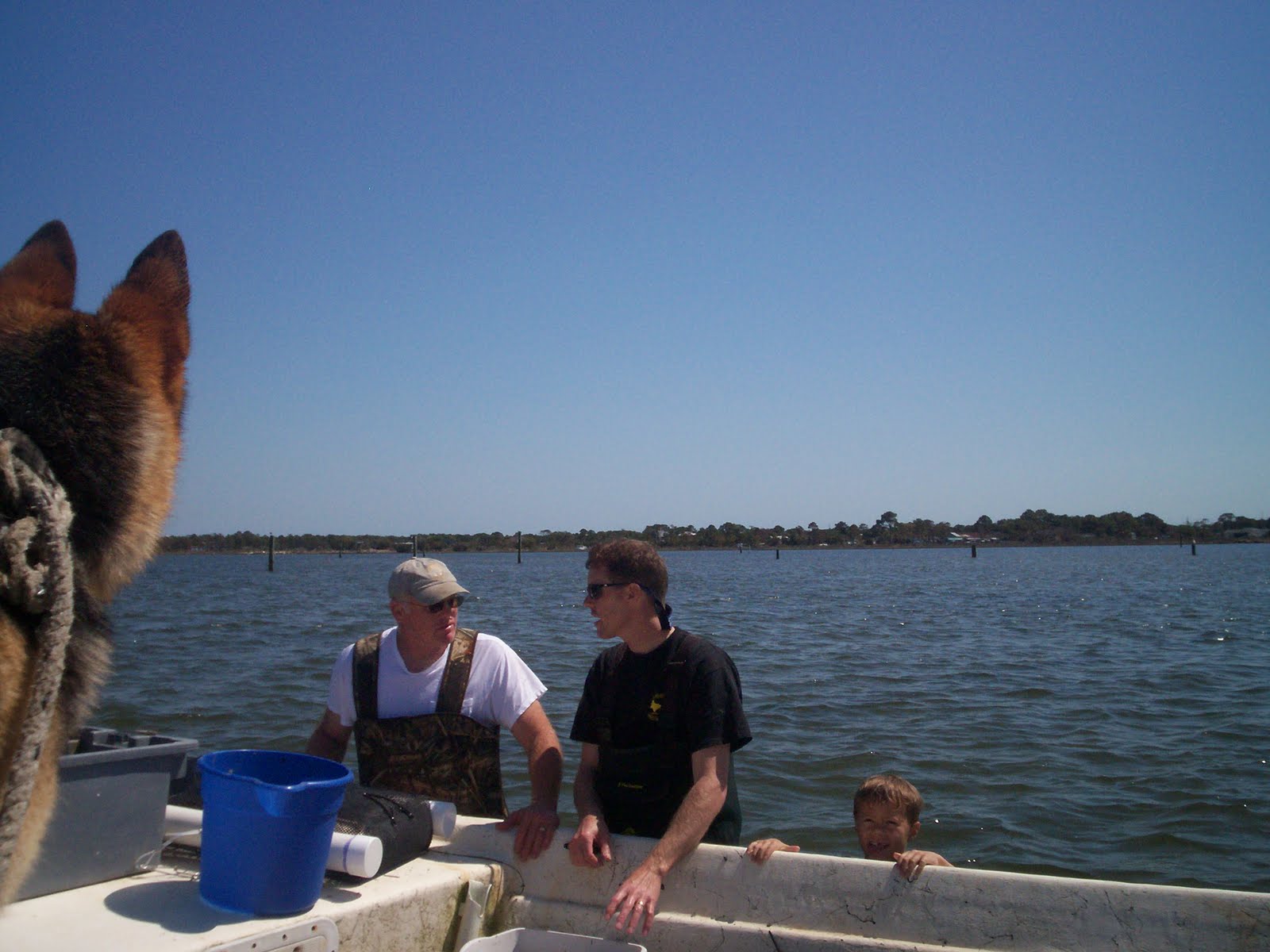 Jimmy, James, and Riley Morris on an oyster farm in the early 2010s